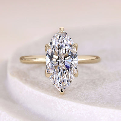 Marquise engagement diamond ring with 6 prong and claw prong setting
