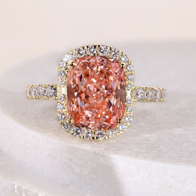 Elongated cushion cut diamond ring with halo
