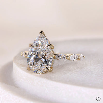prong set ring pear diamond yellow gold ring
