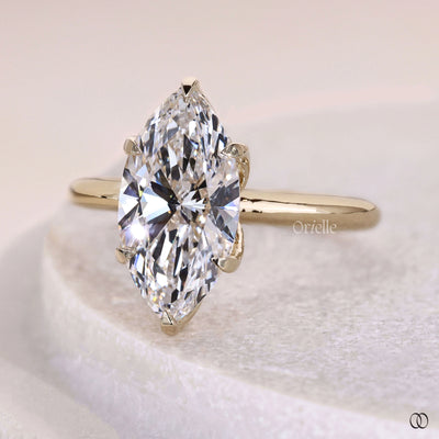 Handmade marquise engagement ring with claw prong and unique setting
