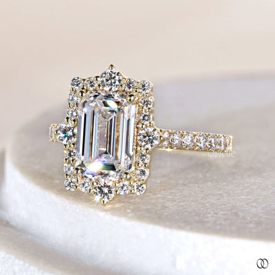 Handmade emerald cut engagement ring with round diamond pave ring band
