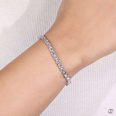 prong setting bracelet emerald diamond tennis style
