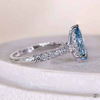 Pear shaped solitaire diamond engagement ring with cathedral setting
