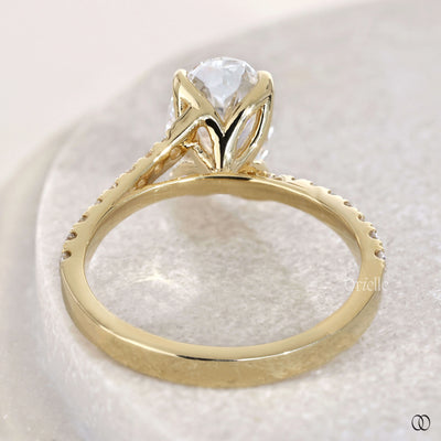 Cathedral engagement ring supporting oval cut diamond
