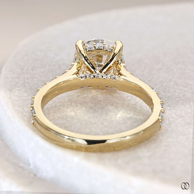 Antique engagement ring inspired round diamond design
