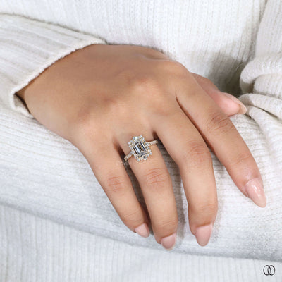 Yellow gold emerald cut engagement ring showcasing refined pave setting ring
