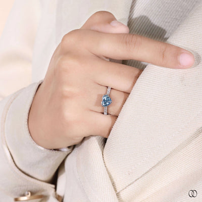 Heart shaped diamond ring with cathedral setting and halo
