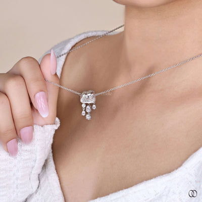 modern cloud diamond pendant with pear and round cuts
