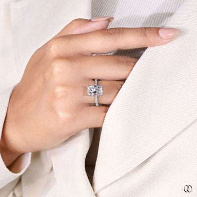 Hidden halo radiant cut diamond ring with pave diamond band
