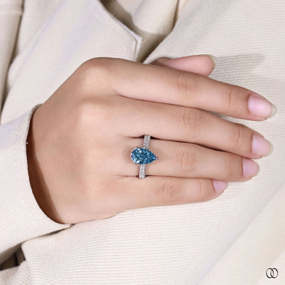 Handmade pear shaped diamond ring with cathedral setting in white gold
