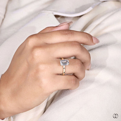 Handmade emerald cut engagement ring with unique gold setting
