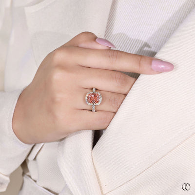 Yellow gold cushion diamond ring with pink stone
