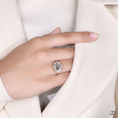 yellow gold ring emerald cut marquise side stone
