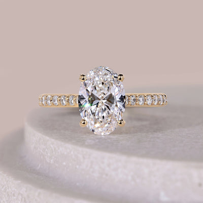 Oval engagement ring with an elegant diamond setting
