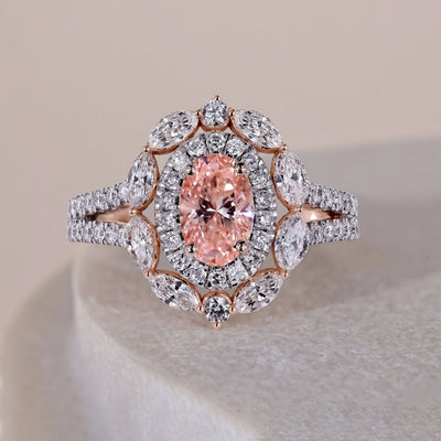 Pink oval cut engagement ring with an elegant diamond setting
