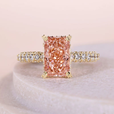 Pink diamond ring with elegant pavé diamond details
