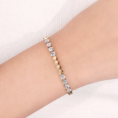 tennis bracelet round cut diamond yellow gold

