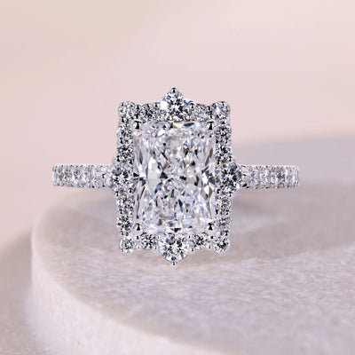 Radiant cut diamond ring with elegant pavé diamond details
