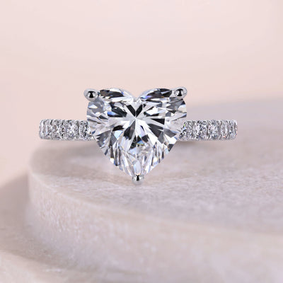 Heart shaped diamond ring with elegant pavé diamond details