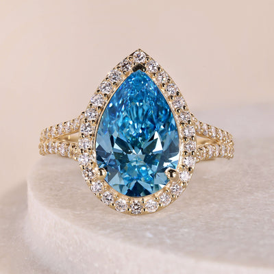 blue diamond ring pear shape halo engagement ring
