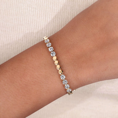 tennis bracelet round cut diamond yellow gold
