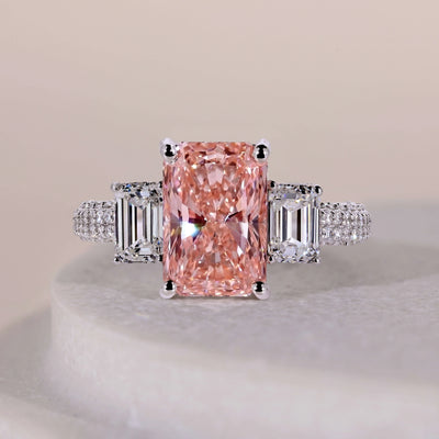 Three stone engagement ring with elegant diamond accents
