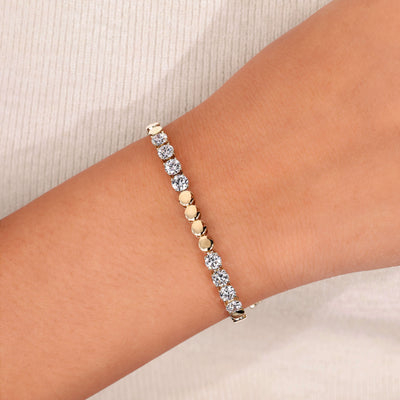 tennis bracelet round cut diamond yellow gold
