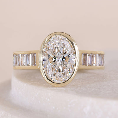 oval cut diamond engagement ring bezel set gold
