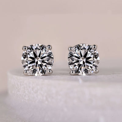 round diamond earrings solitaire white gold studs
