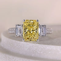 Yellow Radiant Cut Three Stone Diamond Ring With Triple Pave Band