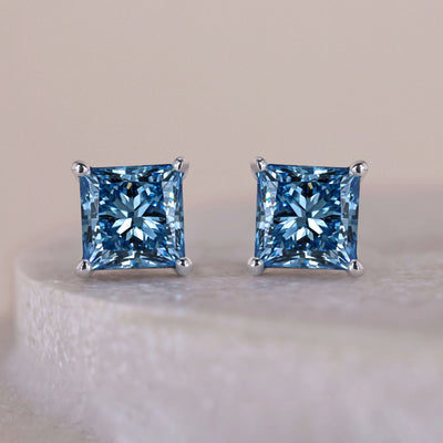 Princess cut diamond earrings with brilliant stones and elegant settings
