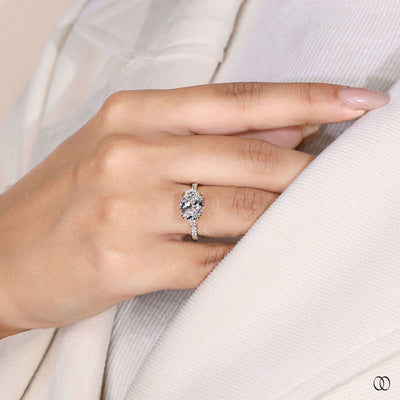 Hidden accent ring beneath east west oval diamond
