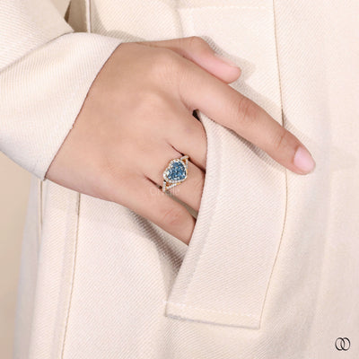 heart shaped ring vivid blue diamond halo
