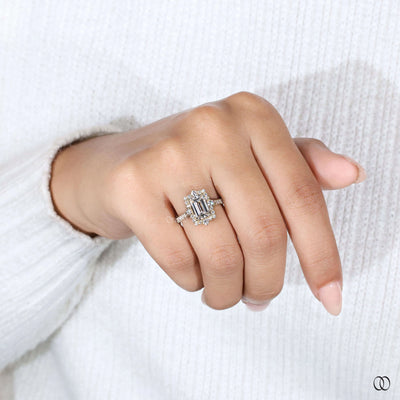 Elegant emerald cut engagement ring paired with round diamond pave ring style
