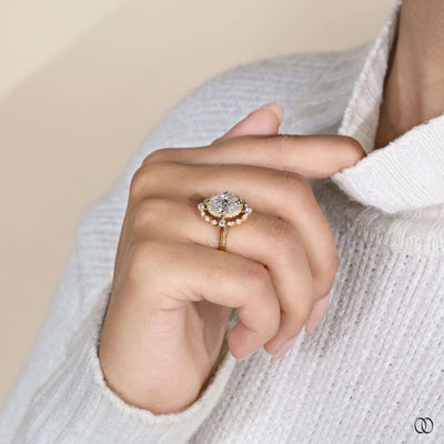 Unique oval engagement ring with round outline diamonds
