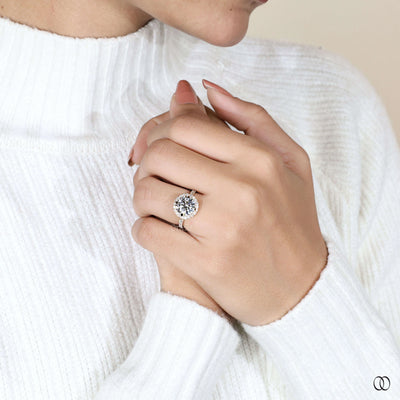 Unique round cut engagement ring with halo setting
