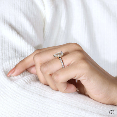Unique pear engagement ring with hidden accent stone
