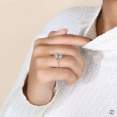 Unique round brilliant engagement ring with halo setting
