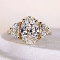 Oval Engagement Ring With Side Stone Half Moon Cut