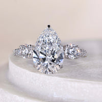 Three Stone Round And Pear Cut Diamond Engagement Ring