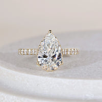 Cathedral Setting Pear Engagement Ring In Yellow Gold