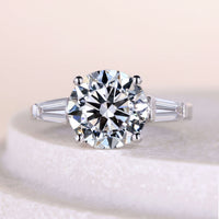 Round Cut Engagement Ring With Side Stone Tapered Baguette