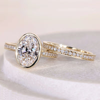 Oval Diamond Enagement Ring With Round Cut Eternity Channel Set Band