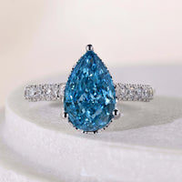 Pear Shaped Pave Setting Engagement Ring With Hidden Halo