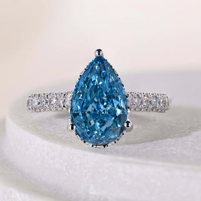 Pear shaped diamond engagement ring with hidden halo in white gold
