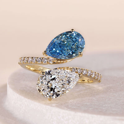 toi et moi engagement ring vivid blue diamond
