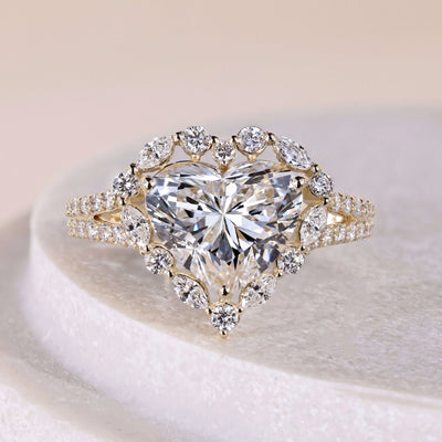 Heart shaped diamond ring with halo setting in yellow gold
