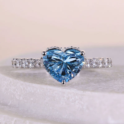 Heart shaped engagement ring with hidden halo and pave band
