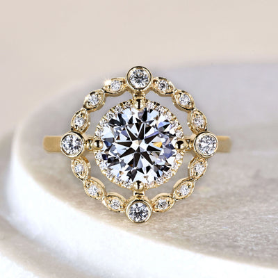 Round cut engagement ring in yellow gold cathedral setting
