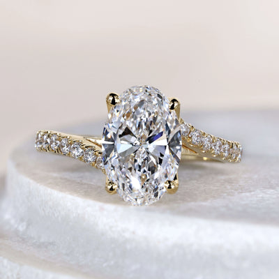 Oval cut engagement ring in yellow gold setting
